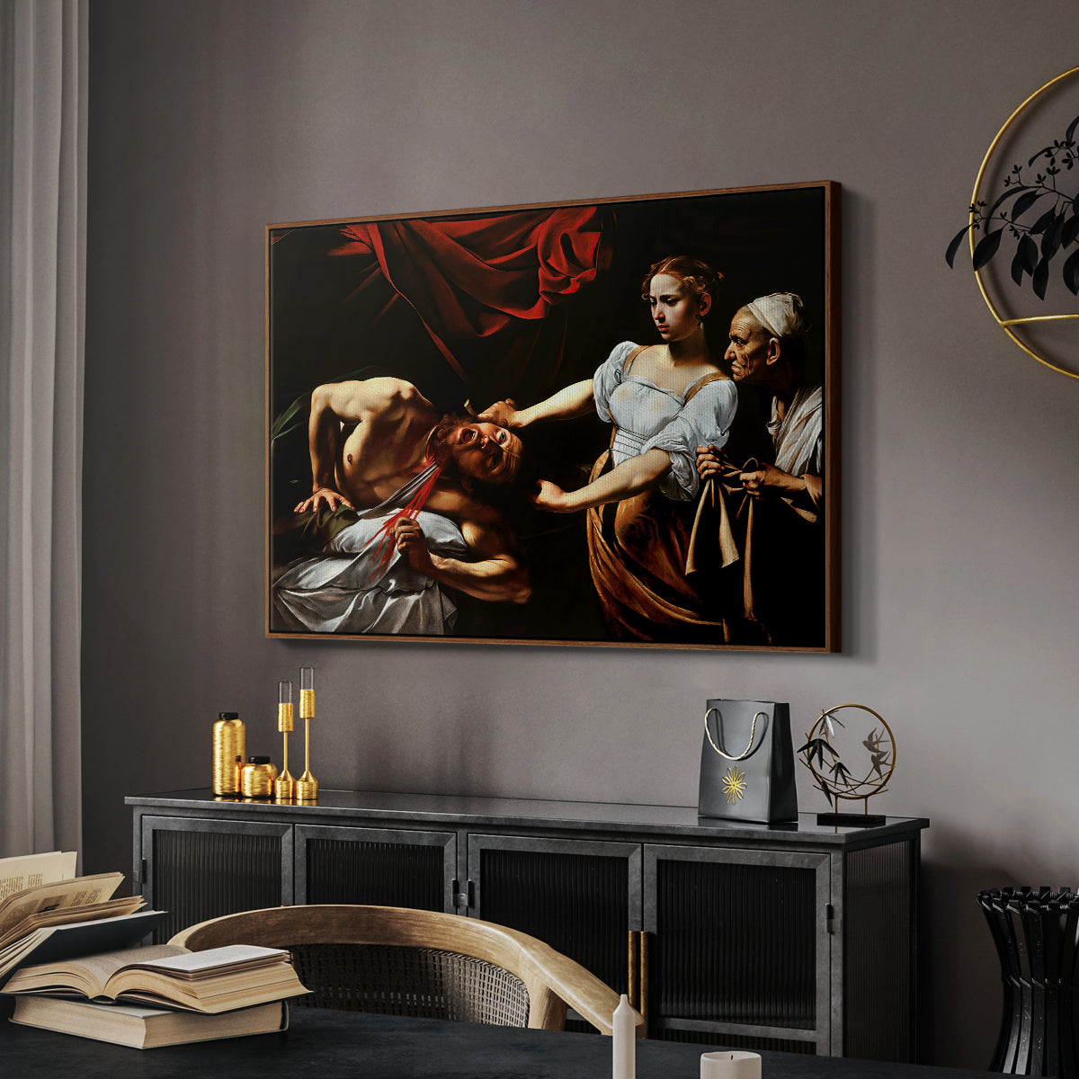 Judith Beheading Holofernes, c. 1599 by Caravaggio in a walnut floater framed canvas featuring an intense moment of Judith slaying Holofernes with sword, displayed above a desk in a dark home office interior.