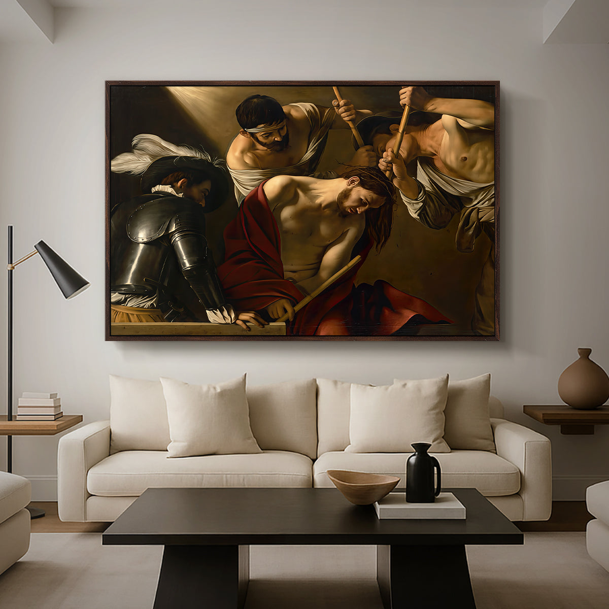 The Crowning with Thorns (Vienna Version), c. 1602-1604 by Caravaggio as a walnut floater framed canvas featuring Christ surrounded by men pressing crown of thorns onto his head, displayed above a sofa in a modern living room.
