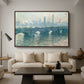 Waterloo Bridge, Gray Weather, 1900 by Claude Monet as a walnut floater framed canvas featuring a hazy view of Waterloo Bridge over river in gray atmospheric light, displayed above a sofa in a modern living room.