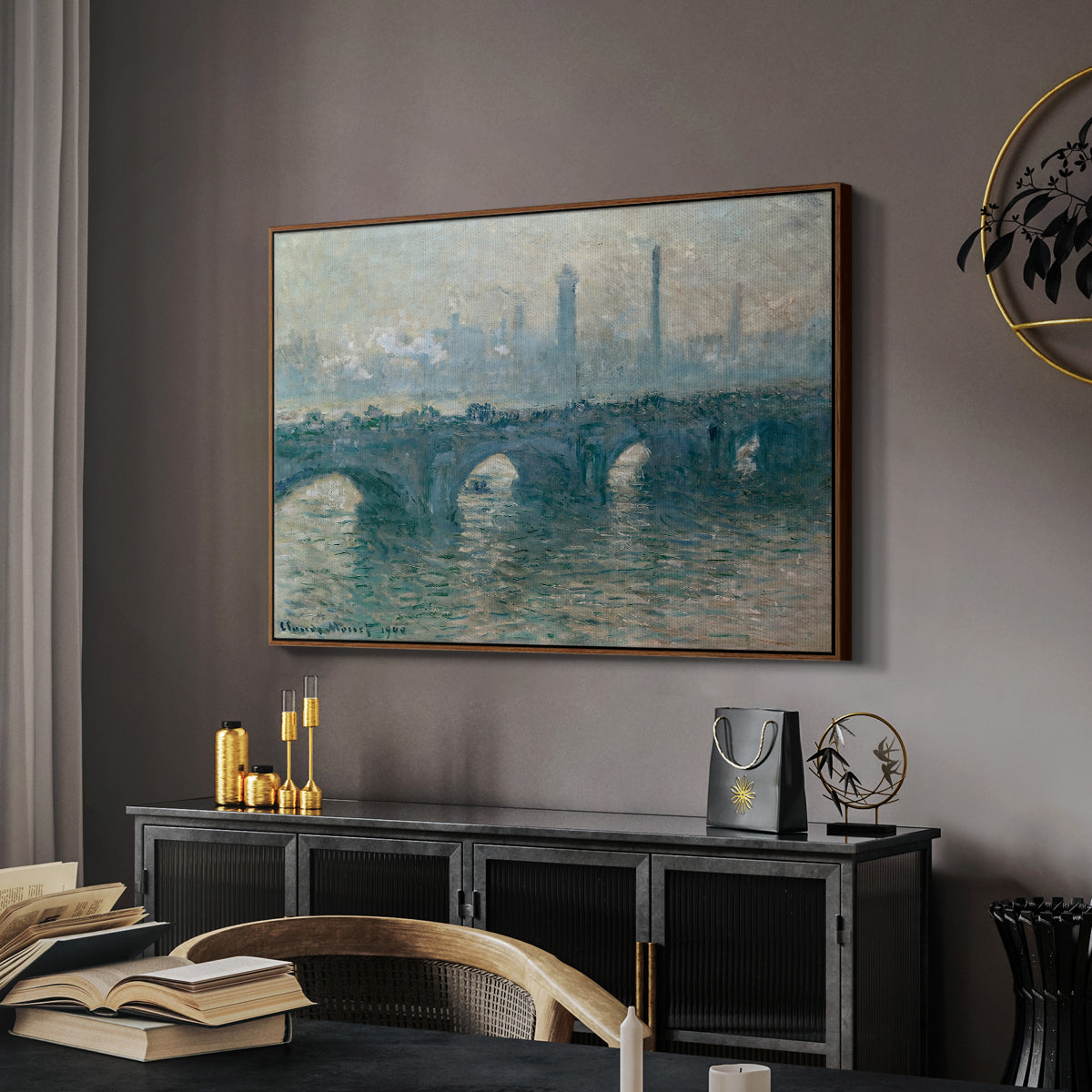 Waterloo Bridge, Gray Weather, 1900 by Claude Monet in a walnut floater framed canvas featuring a soft-toned river scene with bridge and muted skyline, displayed above a desk in a dark home office interior.