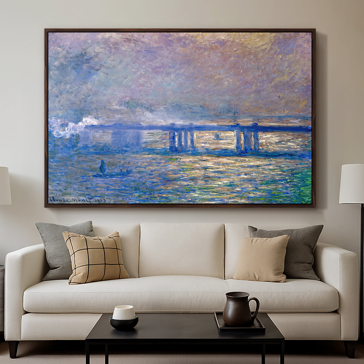 Charing Cross Bridge, 1903 by Claude Monet displayed in a walnut floater framed canvas above a sofa in a clean living room.