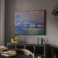 Charing Cross Bridge, 1903 by Claude Monet in a walnut floater framed canvas featuring an atmospheric depiction of London bridge with reflections in water, displayed above a desk in a dark home office interior.