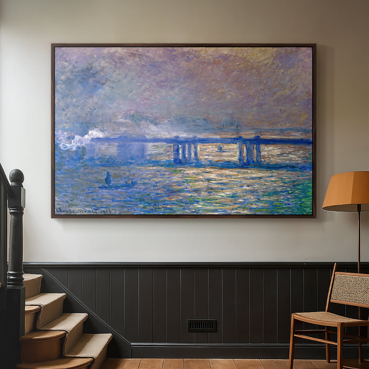 Walnut floater framed canvas featuring a city bridge scene softened by mist and impressionist brushwork, displayed in a hallway near a staircase.