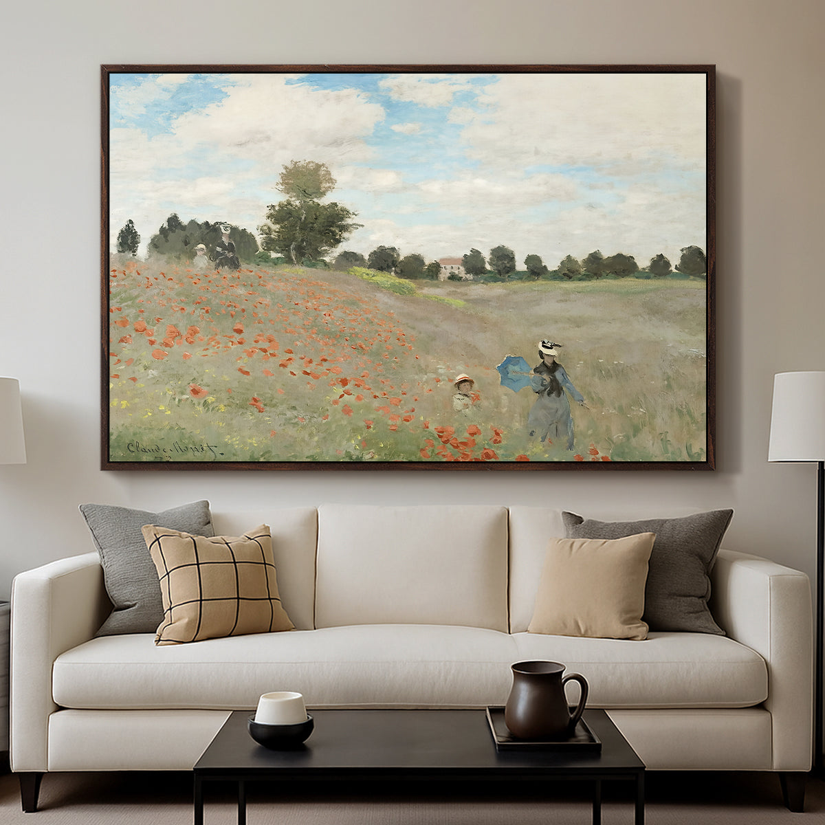 The Poppy Field near Argenteuil, 1873 by Claude Monet displayed in a walnut floater framed canvas above a sofa in a clean living room.
