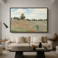The Poppy Field near Argenteuil, 1873 by Claude Monet as a walnut floater framed canvas featuring a field of red poppies with figures walking across rolling landscape, displayed above a sofa in a modern living room.