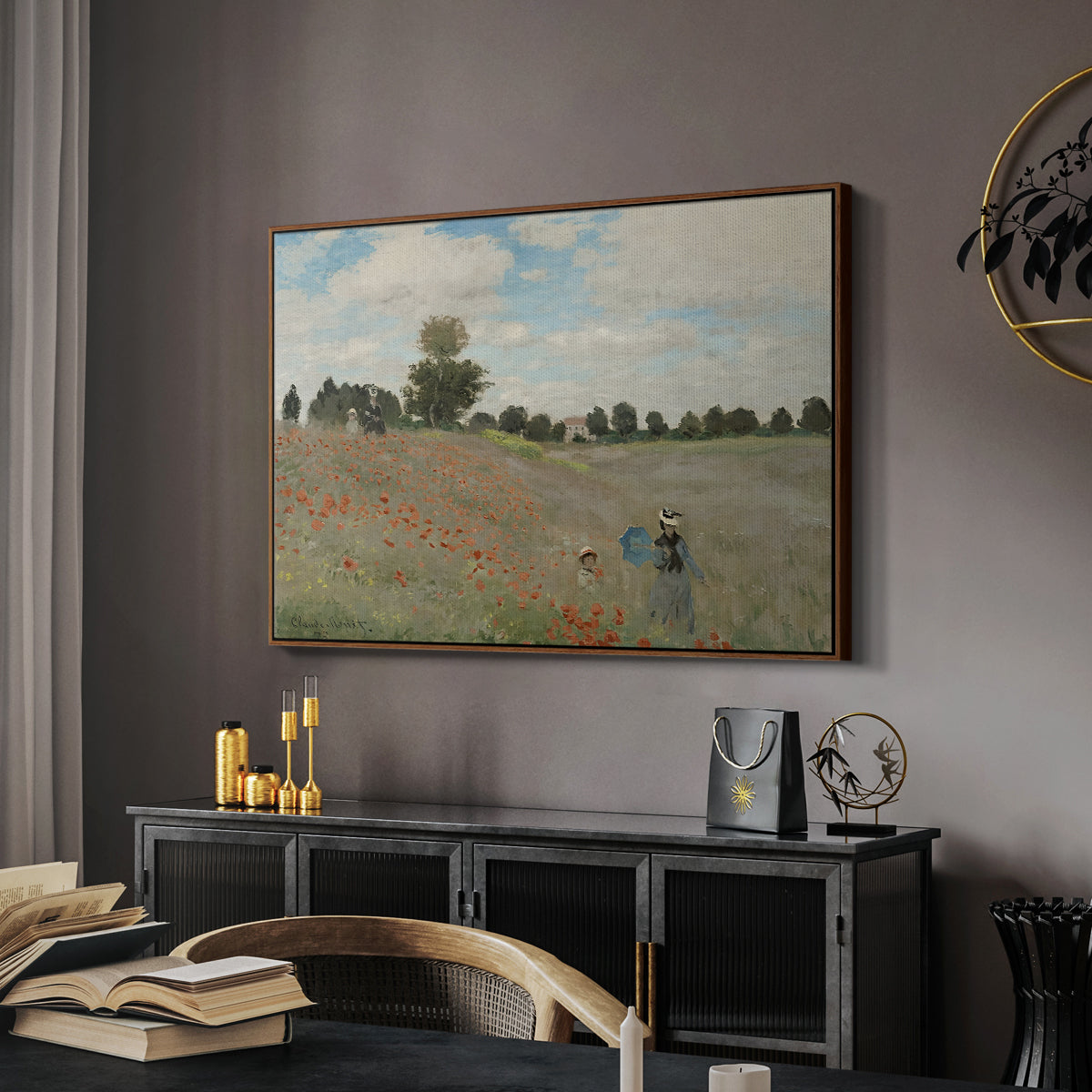 The Poppy Field near Argenteuil, 1873 by Claude Monet in a walnut floater framed canvas featuring a bright meadow filled with poppies under open sky, displayed above a desk in a dark home office interior.