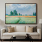 The Wheat Field (Champ de Blé), 1881 by Claude Monet displayed in a walnut floater framed canvas above a sofa in a clean living room.