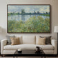Banks of the Seine, Vétheuil, 1880 by Claude Monet displayed in a walnut floater framed canvas above a sofa in a clean living room.