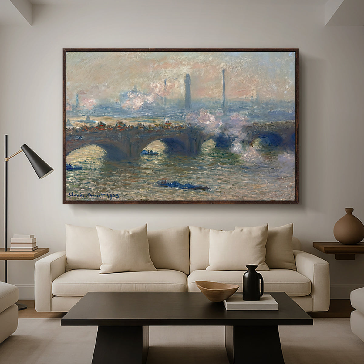 Waterloo Bridge, Gray Day, 1903 by Claude Monet as a walnut floater framed canvas featuring a muted cityscape of bridge spanning river under overcast sky, displayed above a sofa in a modern living room.