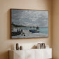 Walnut floater framed canvas of The Beach at Sainte-Adresse, 1867 by Claude Monet, featuring a lively beach scene with people overlooking water and ships above a console cabinet in a minimalist entryway.