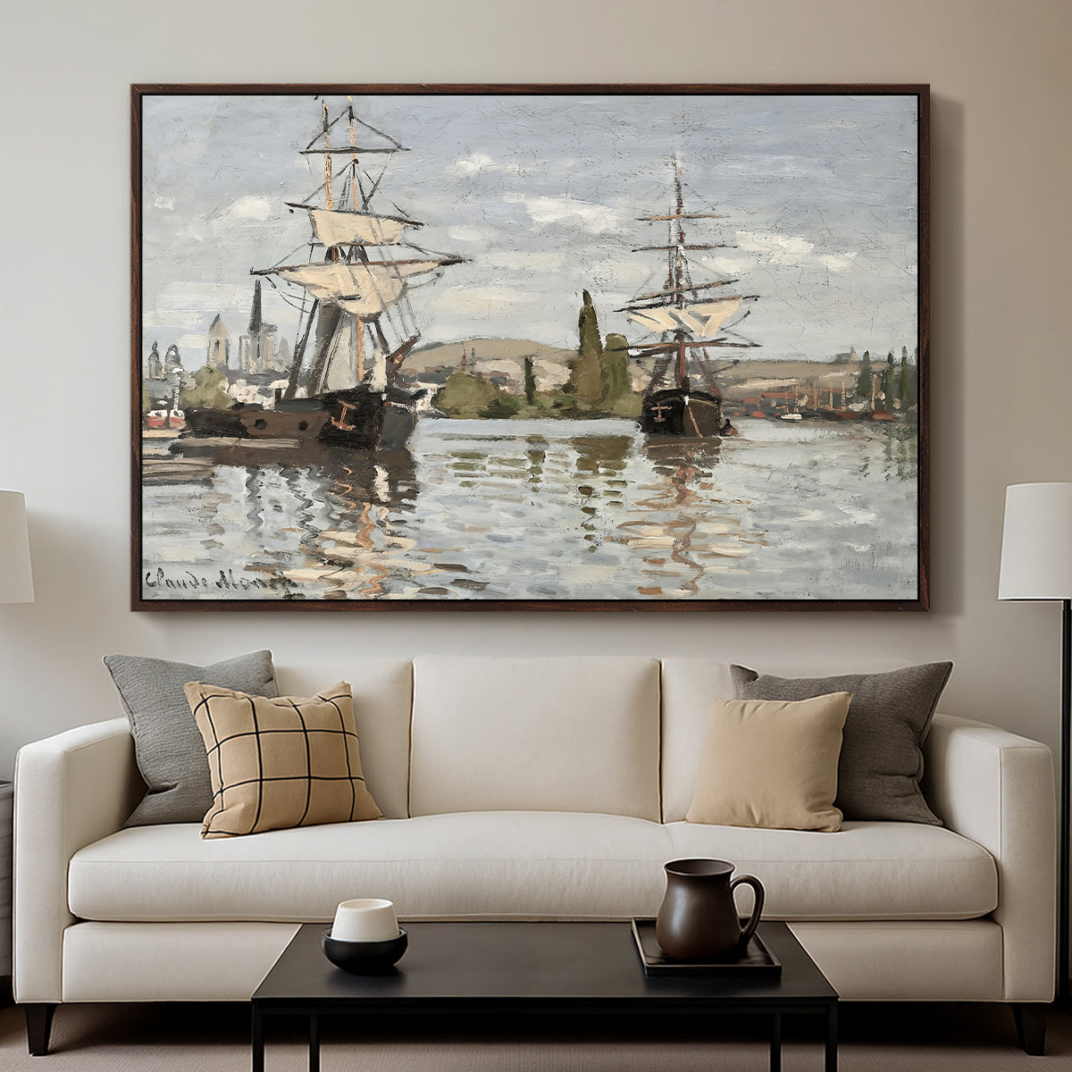 Ships Riding on the Seine at Rouen, 1872 by Claude Monet displayed in a walnut floater framed canvas above a sofa in a clean living room.