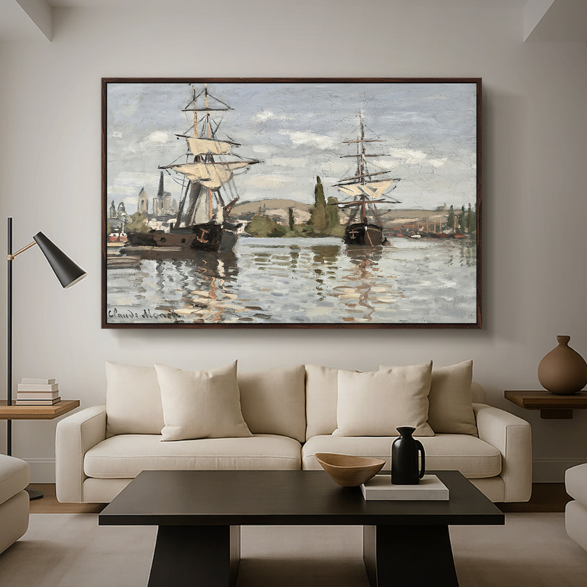 Ships Riding on the Seine at Rouen, 1872 by Claude Monet as a walnut floater framed canvas featuring large ships docked along the Seine with masts rising against soft sky, displayed above a sofa in a modern living room.