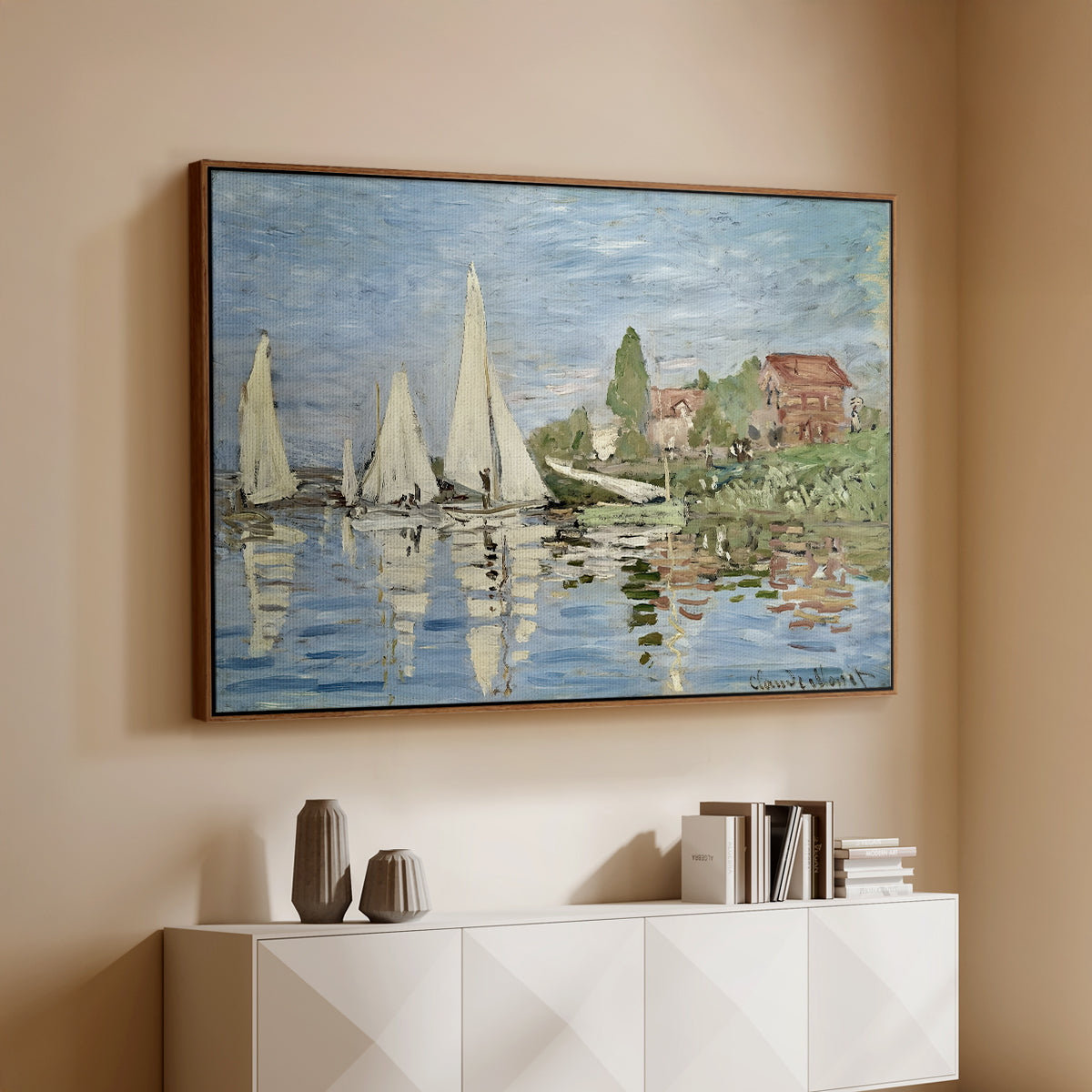 Walnut floater framed canvas of Regatta at Argenteuil, 1872 by Claude Monet, featuring a lively regatta scene with multiple boats and fluttering sails above a console cabinet in a minimalist entryway.