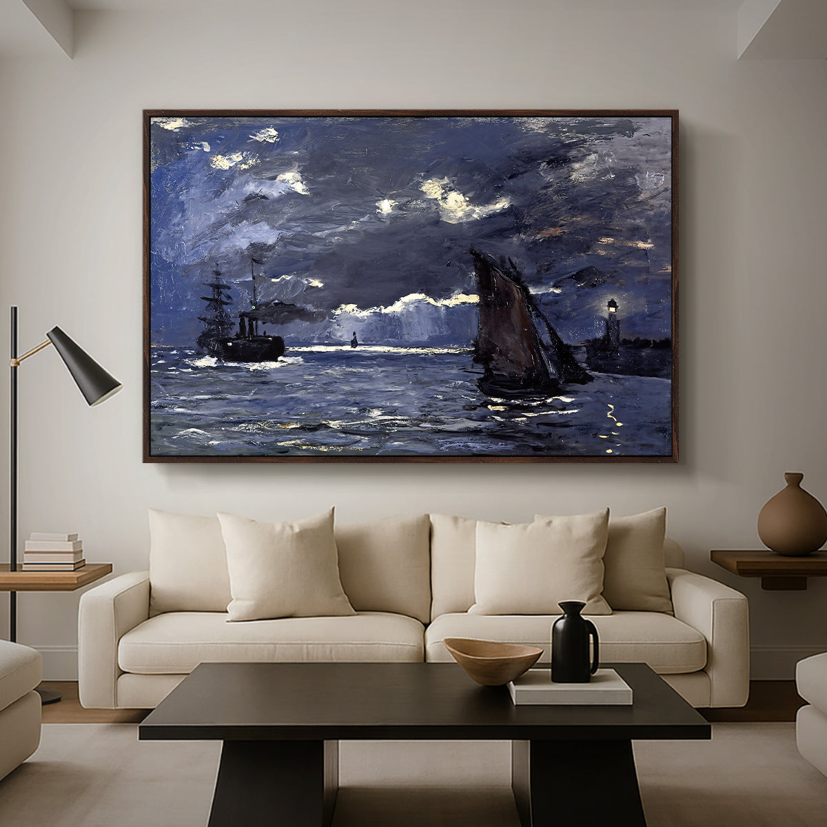 A Seascape, Shipping by Moonlight, 1864 by Claude Monet as a walnut floater framed canvas featuring ships on dark sea illuminated by moonlight under night sky, displayed above a sofa in a modern living room.