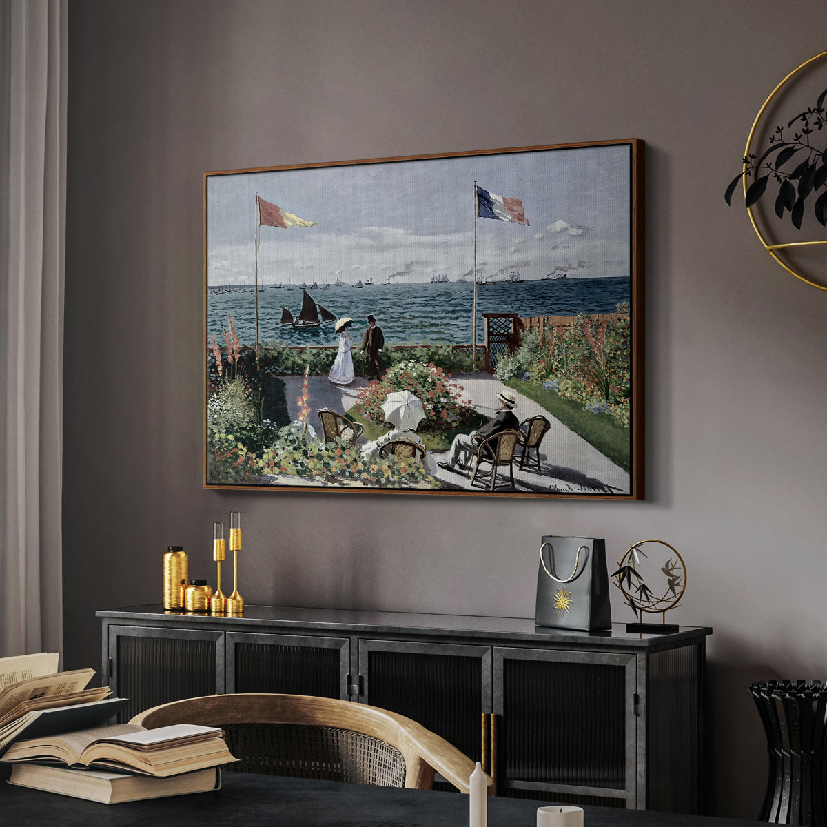 Garden at Sainte-Adresse, 1867 by Claude Monet in a walnut floater framed canvas featuring a vibrant garden scene with colorful blooms and distant sea, displayed above a desk in a dark home office interior.