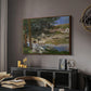 On the Bank of the Seine, Bennecourt, 1868 by Claude Monet in a walnut floater framed canvas featuring an impressionist landscape with people relaxing along the Seine, displayed above a desk in a dark home office interior.