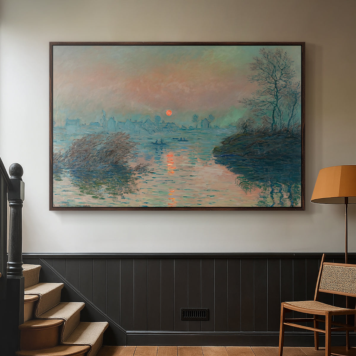 Walnut floater framed canvas featuring an atmospheric landscape combining cold tones and warm sky, displayed in a hallway near a staircase.