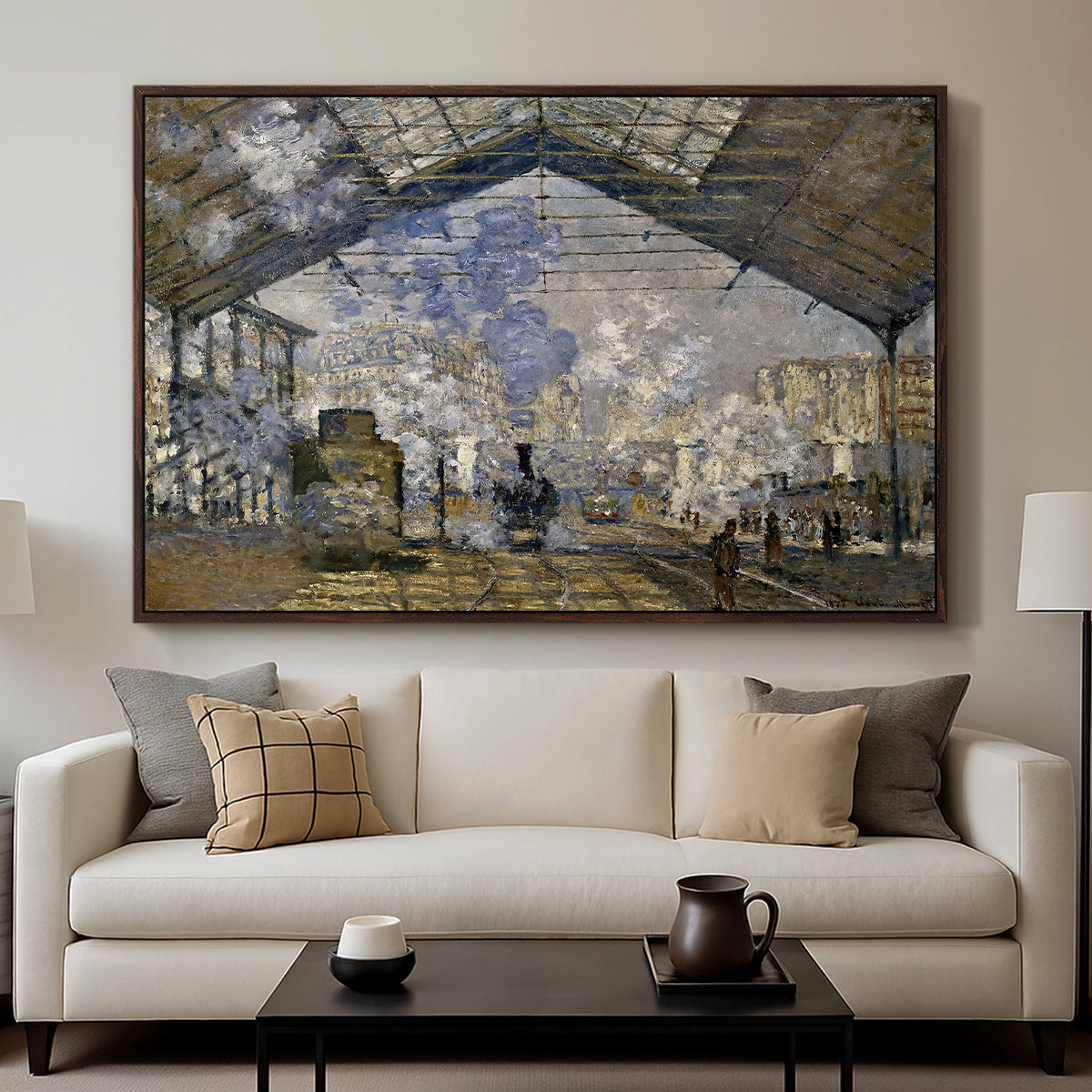 The Gare Saint-Lazare, 1877 by Claude Monet displayed in a walnut floater framed canvas above a sofa in a clean living room.