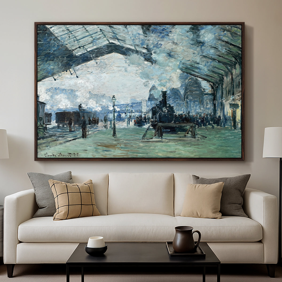 The Saint-Lazare Station, 1877 by Claude Monet displayed in a walnut floater framed canvas above a sofa in a clean living room.