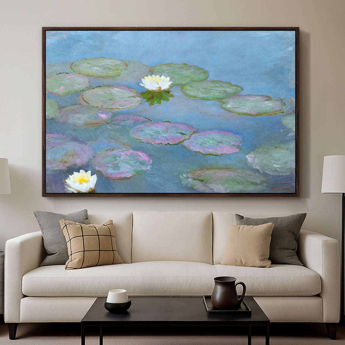 Water Lilies (Nymphéas), 1897-1899 by Claude Monet displayed in a walnut floater framed canvas above a sofa in a clean living room.