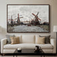 Windmills near Zaandam, 1871 by Claude Monet displayed in a walnut floater framed canvas above a sofa in a clean living room.