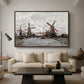 Windmills near Zaandam, 1871 by Claude Monet as a walnut floater framed canvas featuring windmills standing beside water under open sky in rural landscape, displayed above a sofa in a modern living room.
