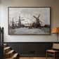Walnut floater framed canvas featuring a landscape featuring windmills and low horizon sky, displayed in a hallway near a staircase.