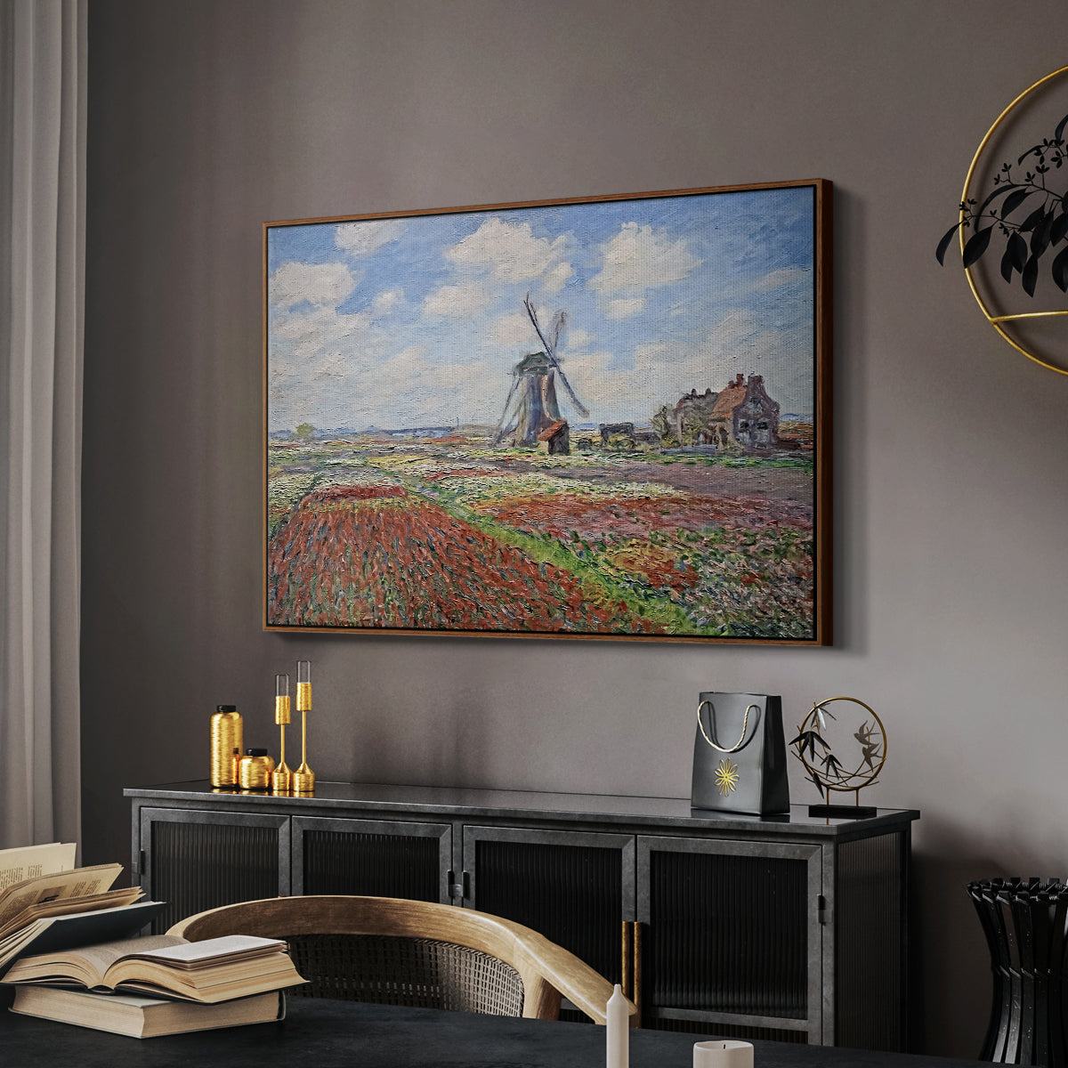 Tulip Fields with the Rijnsburg Windmill, 1886 by Claude Monet in a walnut floater framed canvas featuring an impressionist field of blooming tulips under bright sky, displayed above a desk in a dark home office interior.