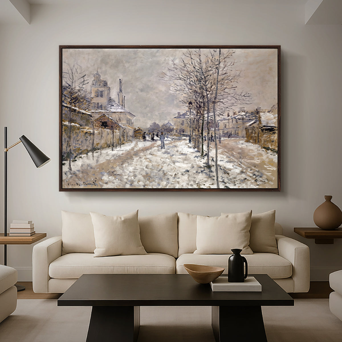 The Boulevard de Pontoise at Argenteuil, Snow Effect, 1875 by Claude Monet as a walnut floater framed canvas featuring a snow-covered street lined with trees and buildings under winter sky, displayed above a sofa in a modern living room.