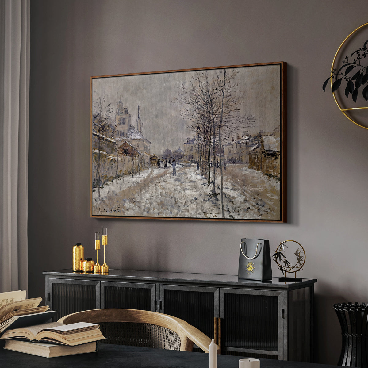 The Boulevard de Pontoise at Argenteuil, Snow Effect, 1875 by Claude Monet in a walnut floater framed canvas featuring a quiet boulevard blanketed in snow with distant figures, displayed above a desk in a dark home office interior.