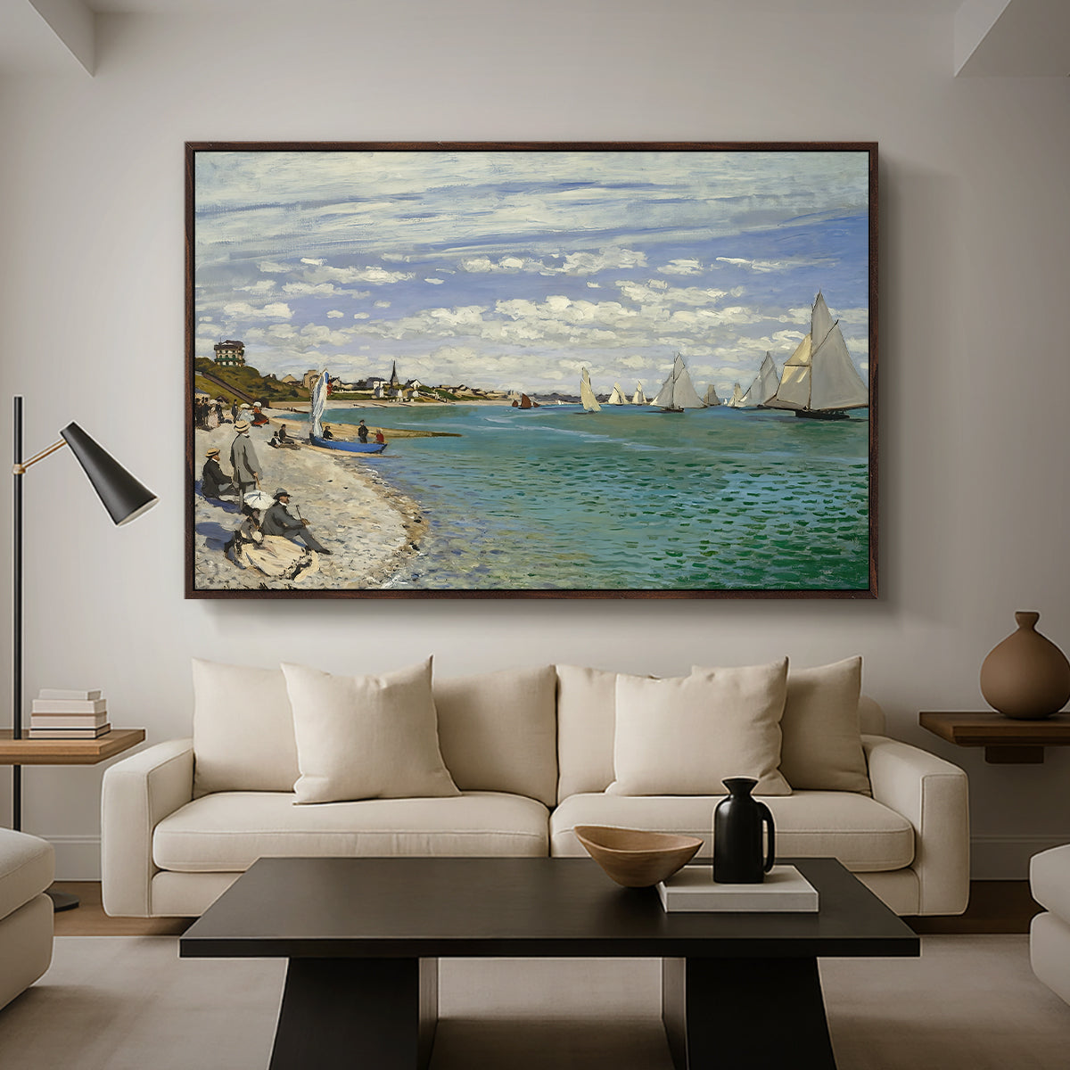 Regatta at Sainte-Adresse, 1867 by Claude Monet as a walnut floater framed canvas featuring sailboats gathered near shore with flags and spectators along coastline, displayed above a sofa in a modern living room.