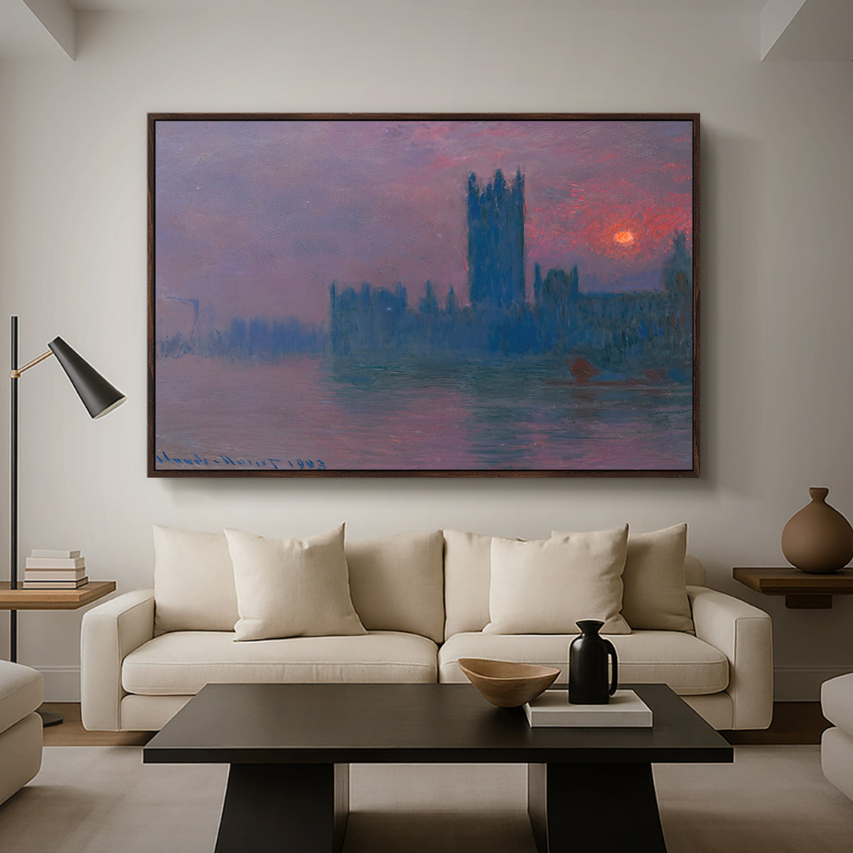 The Houses of Parliament, Sunset, 1903 by Claude Monet as a walnut floater framed canvas featuring a silhouette of Parliament buildings against glowing sunset across river, displayed above a sofa in a modern living room.