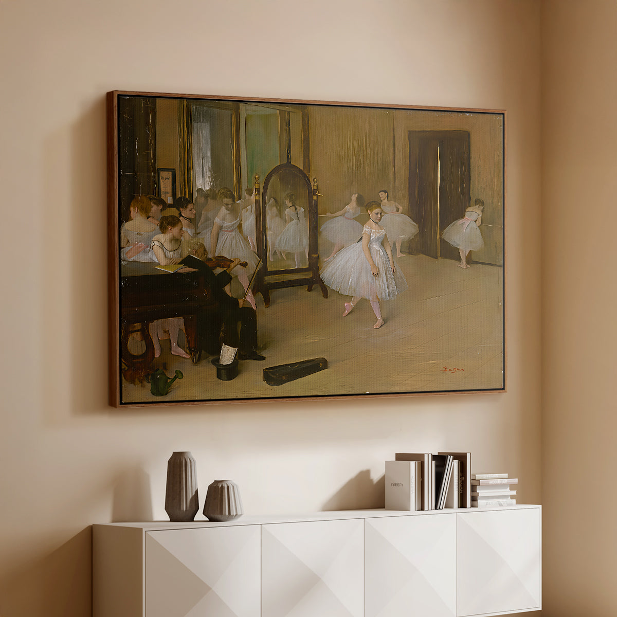 Walnut floater framed canvas of The Dancing Class, c. 1870 by Edgar Degas, featuring a rehearsal scene with ballerinas in tutus arranged in studio above a console cabinet in a minimalist entryway.