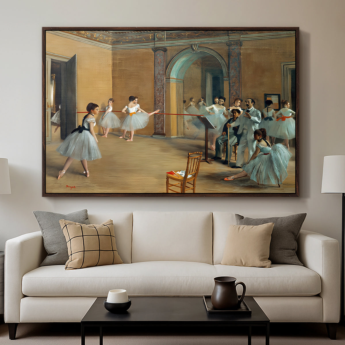The Dance Foyer at the Opera on the Rue Le Peletier, 1872 by Edgar Degas displayed in a walnut floater framed canvas above a sofa in a clean living room.