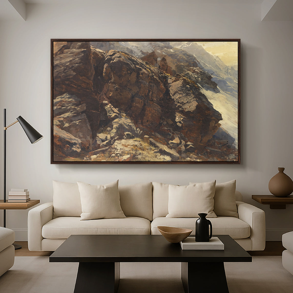 High Mountain Study, c. 1870 by Edward Theodore Compton as a walnut floater framed canvas featuring a rocky alpine terrain with steep slopes and distant mountain peaks, displayed above a sofa in a modern living room.
