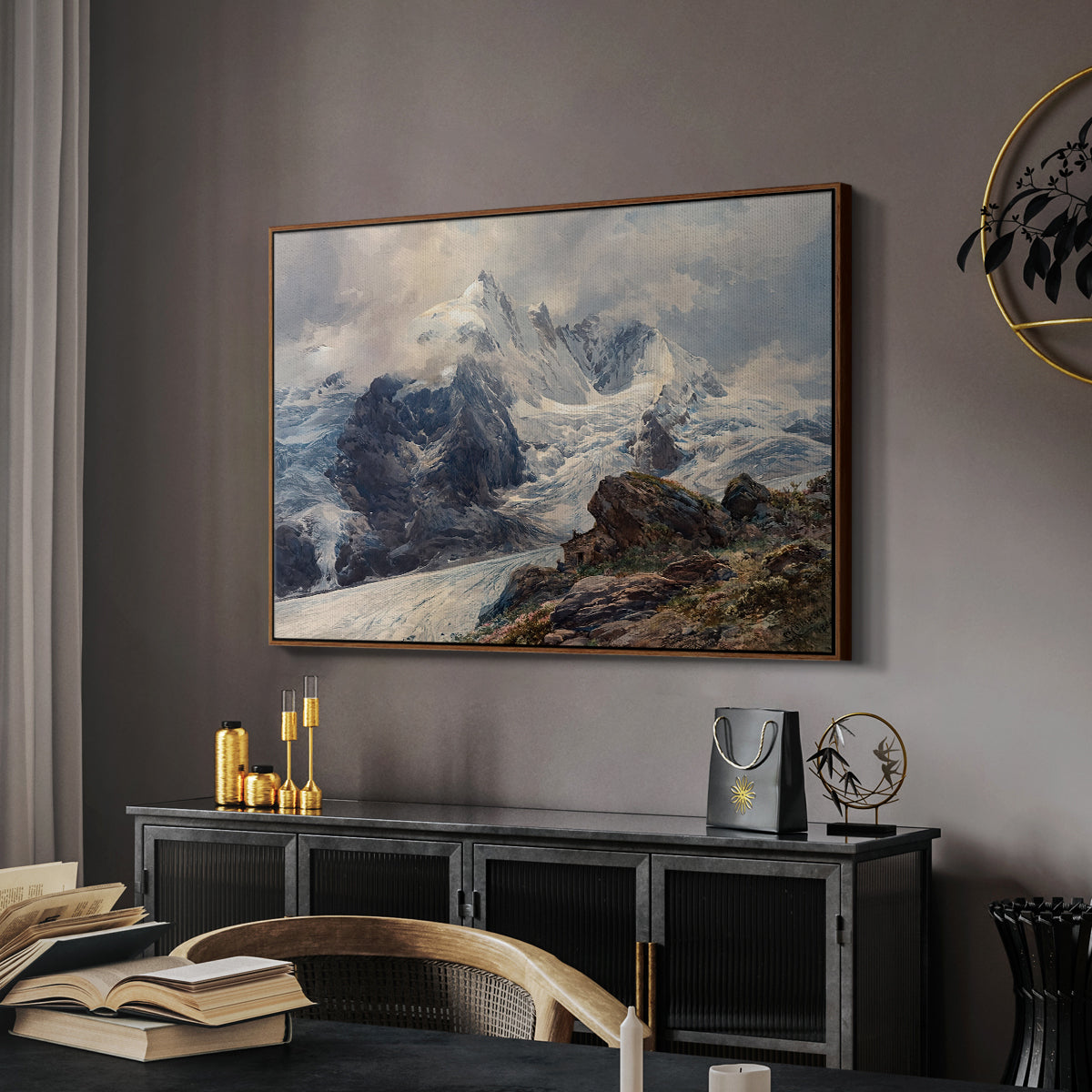 The Grossglockner, 1880 by Edward Theodore Compton in a walnut floater framed canvas featuring a realistic landscape of high mountain under open sky, displayed above a desk in a dark home office interior.