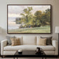 Landscape at Lake Starnberg, 1890 by Edward Theodore Compton displayed in a walnut floater framed canvas above a sofa in a clean living room.