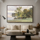 Landscape at Lake Starnberg, 1890 by Edward Theodore Compton as a walnut floater framed canvas featuring a lakeside landscape with calm water and trees along shoreline, displayed above a sofa in a modern living room.
