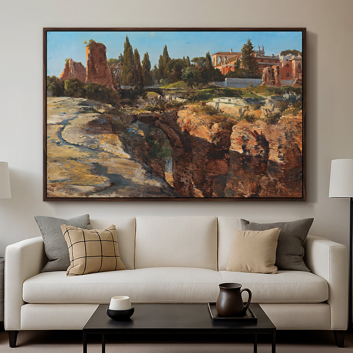 Palatine in Rome, c. 1921 by Edward Theodore Compton displayed in a walnut floater framed canvas above a sofa in a clean living room.