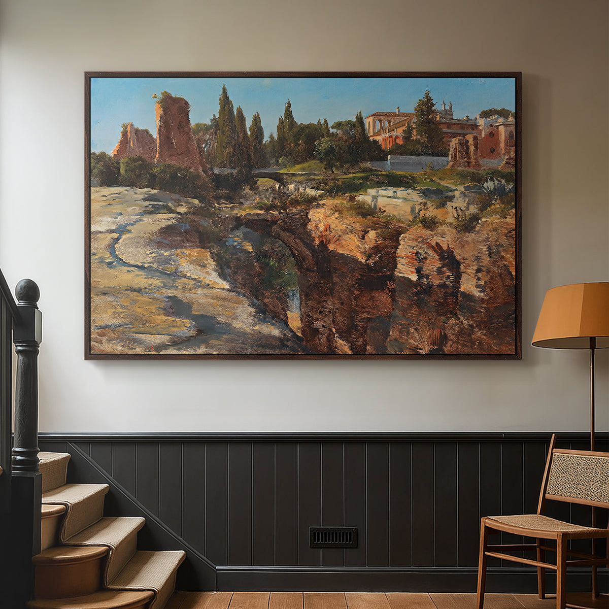 Walnut floater framed canvas featuring a detailed depiction of historic Roman architecture, displayed in a hallway near a staircase.