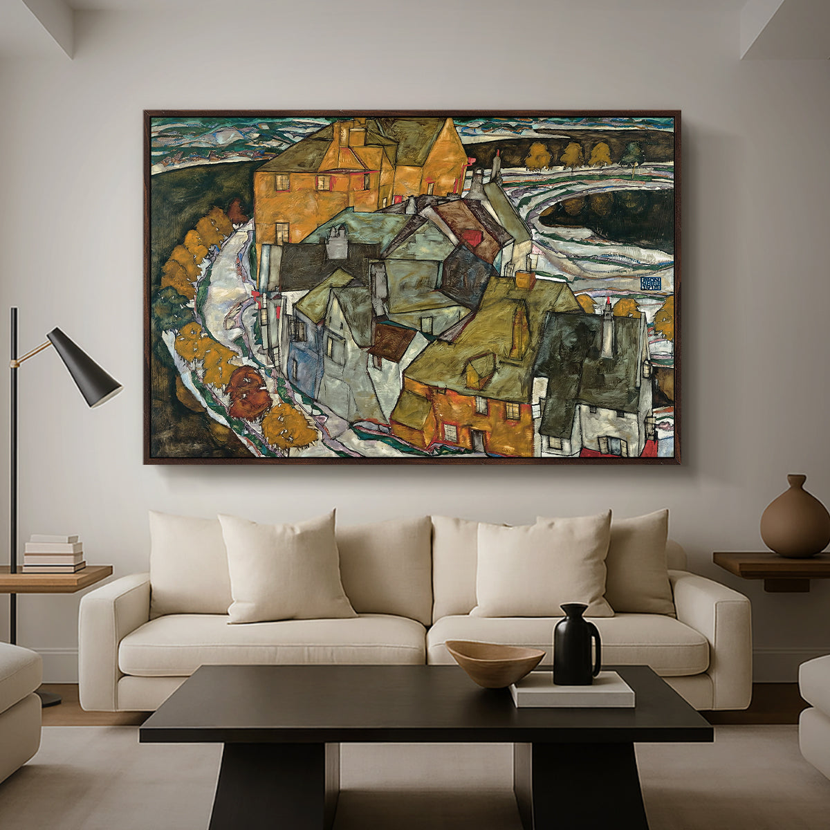 Crescent of Houses II (Island Town), 1915 by Egon Schiele as a walnut floater framed canvas featuring a curved row of colorful houses forming crescent shape along water, displayed above a sofa in a modern living room.