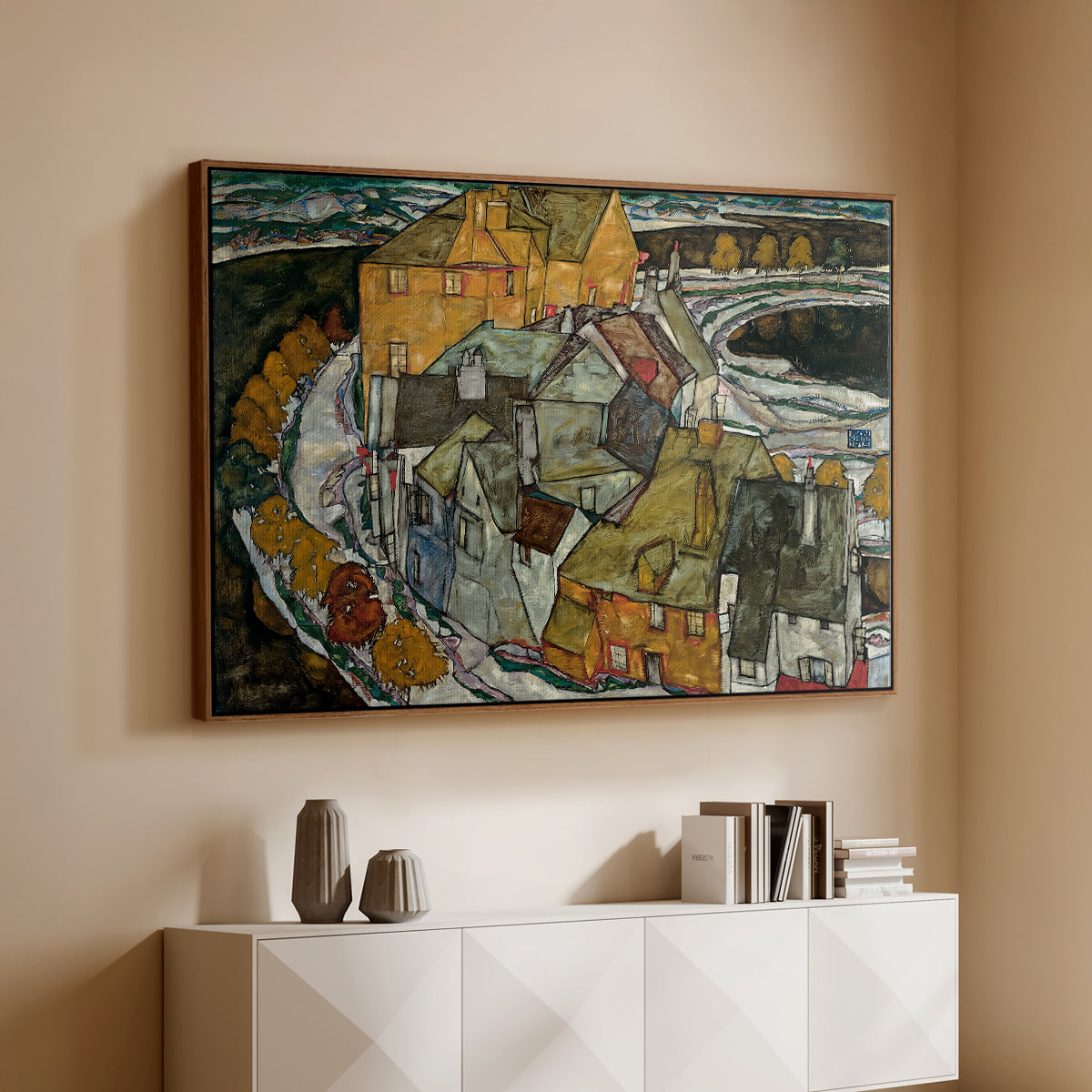 Walnut floater framed canvas of Crescent of Houses II (Island Town), 1915 by Egon Schiele, featuring a stylized townscape with clustered buildings and bold outlines above a console cabinet in a minimalist entryway.