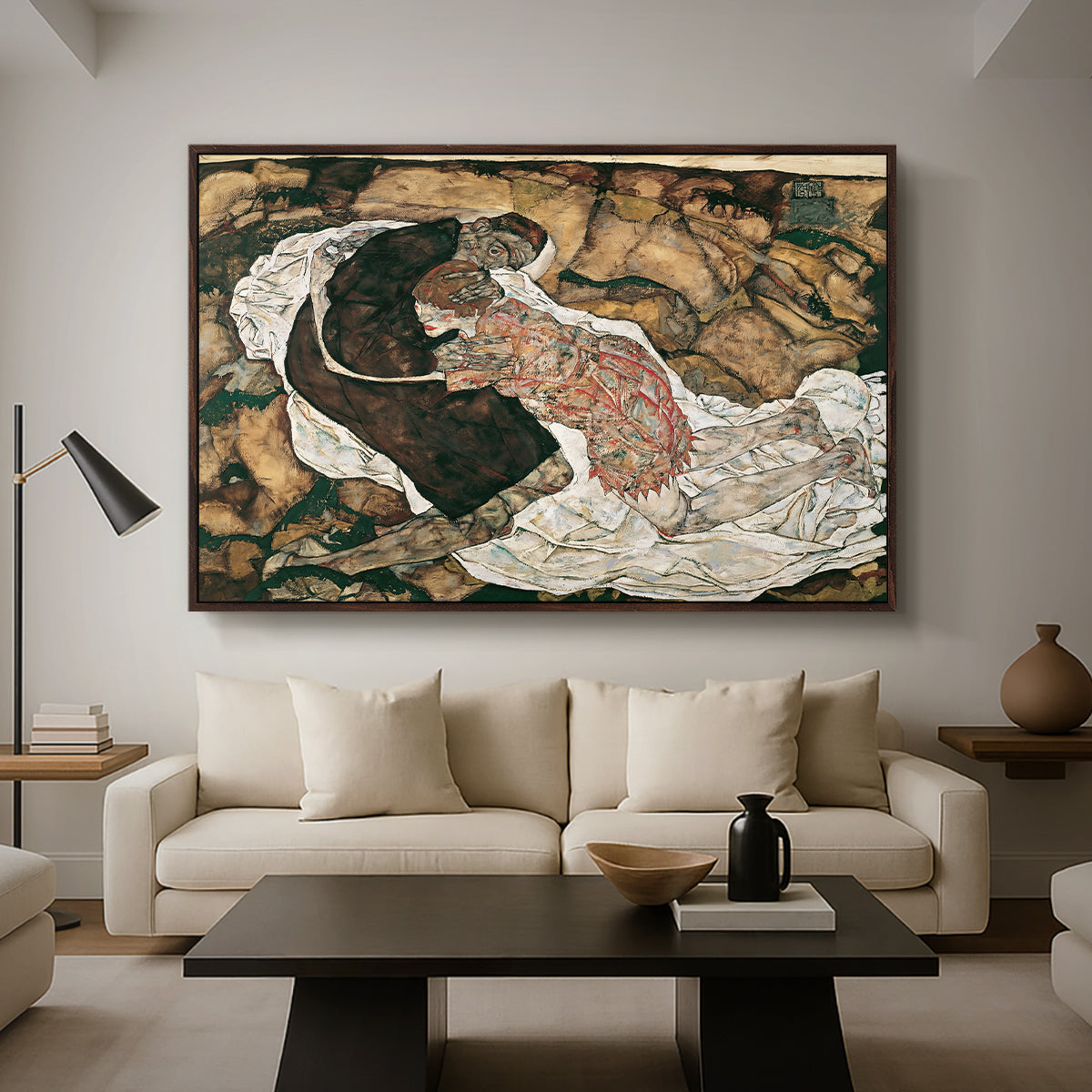 Death and the Maiden, 1915 by Egon Schiele as a walnut floater framed canvas featuring intertwined figures representing death and woman in emotional embrace, displayed above a sofa in a modern living room.