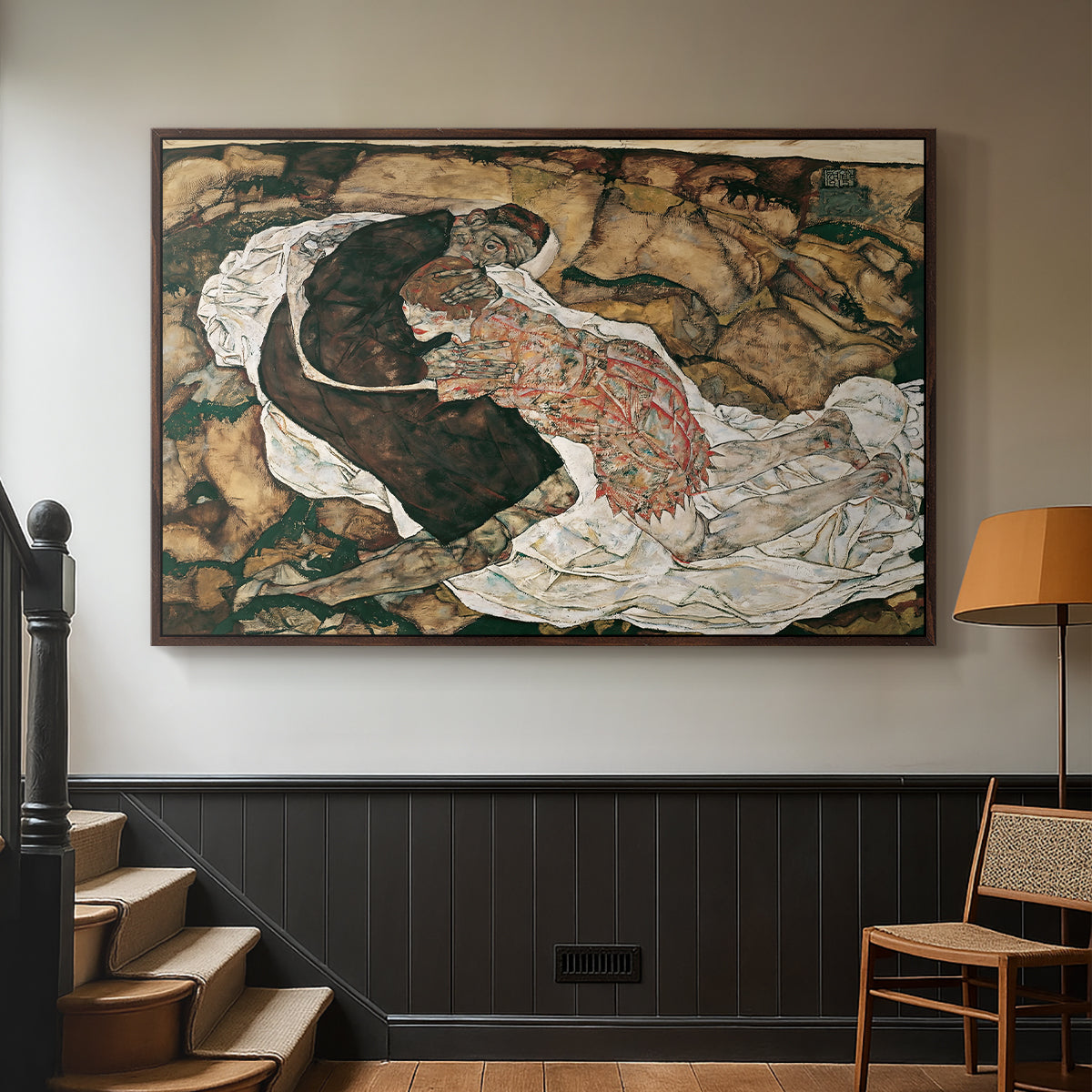 Walnut floater framed canvas featuring an intense composition exploring life and death through figures, displayed in a hallway near a staircase.