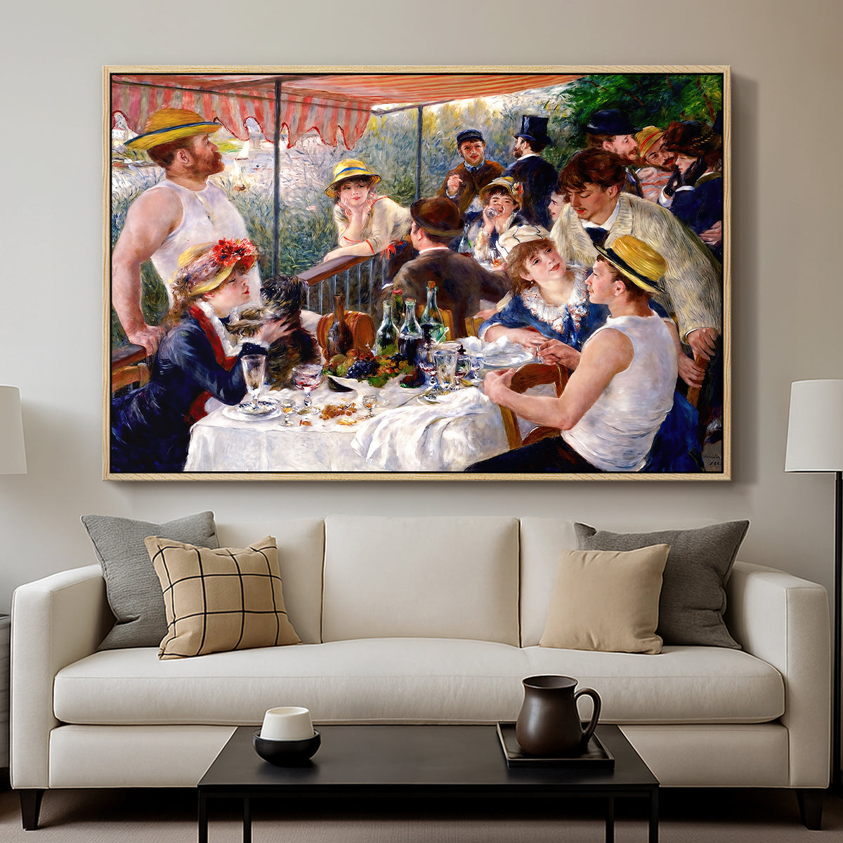 Luncheon of the Boating Party (Le Déjeuner des canotiers), 1880-1881 by Pierre-Auguste Renoir displayed in a natural wood floater framed canvas above a sofa in a clean living room.
