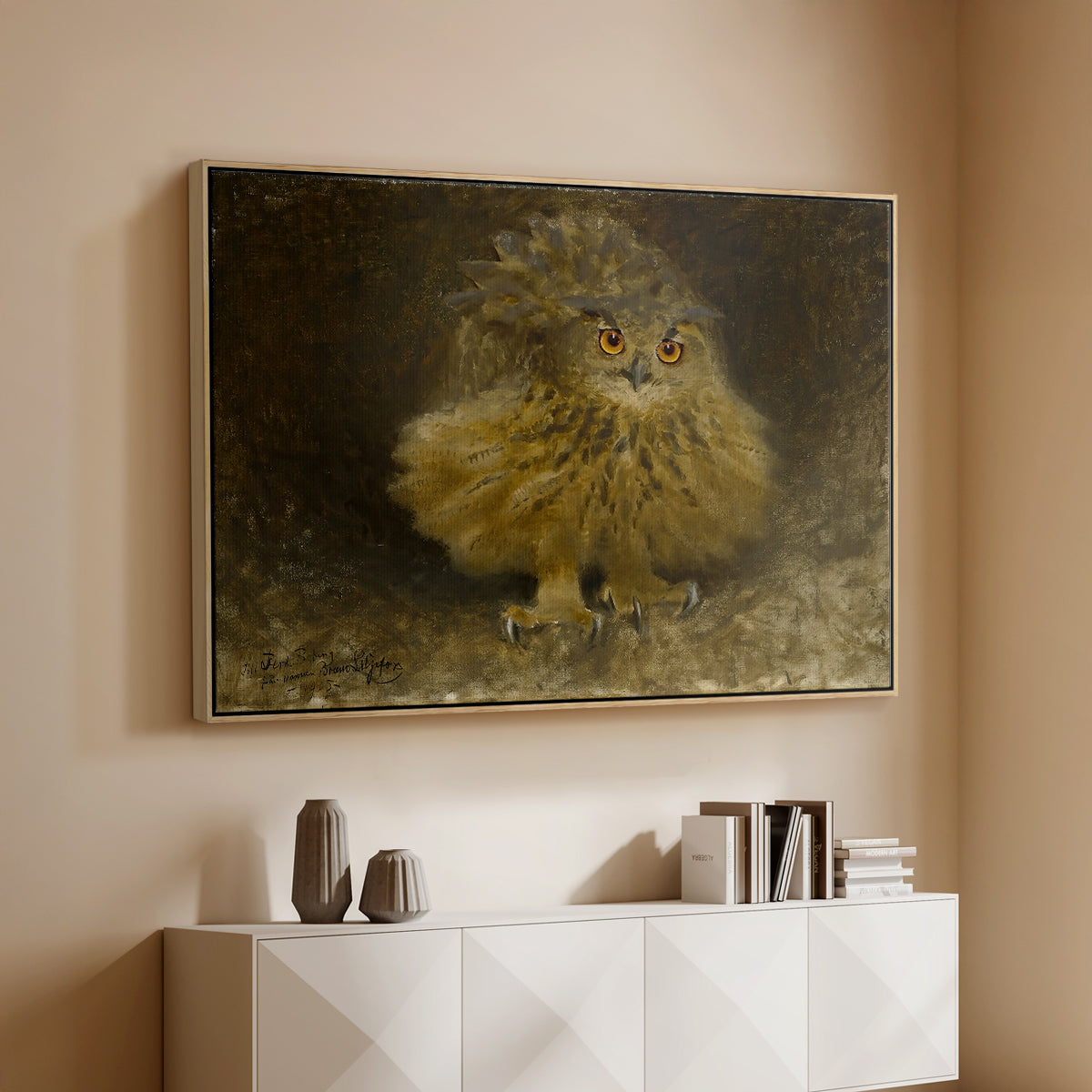Natural wood floater framed canvas of An Eagle Owl (Berguv), 1905 by Bruno Liljefors, featuring a detailed wildlife painting of eagle owl with piercing eyes in darkness above a console cabinet in a minimalist entryway.