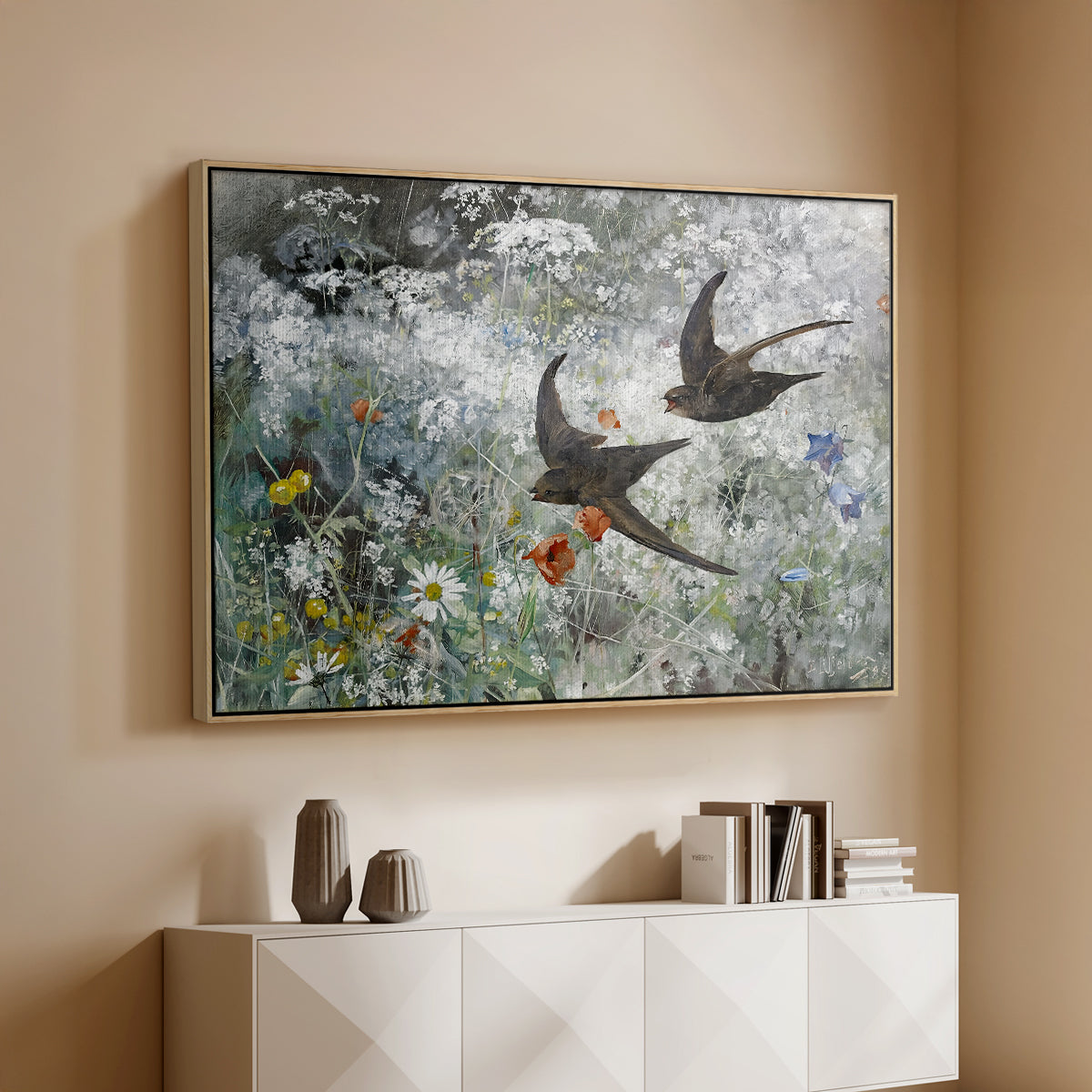Natural wood floater framed canvas of Common Swifts, 1886 by Bruno Liljefors, featuring swifts gliding midair with wings spread against soft sky above a console cabinet in a minimalist entryway.