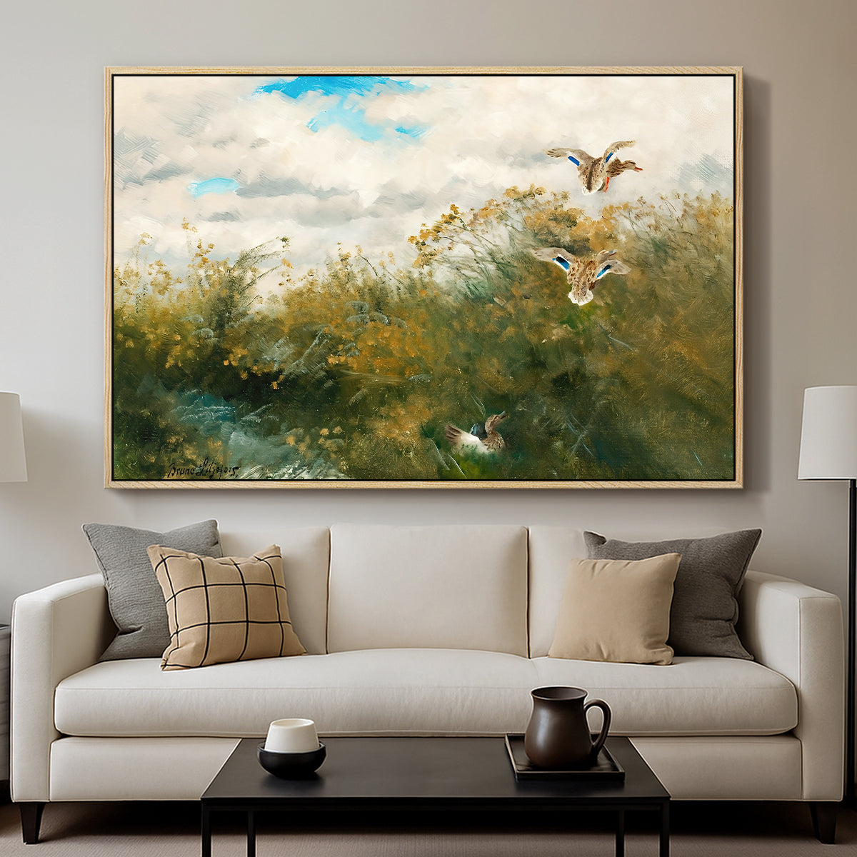 Wild Ducks (Grasänder), 1890 by Bruno Liljefors displayed in a natural wood floater framed canvas above a sofa in a clean living room.