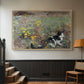 Natural wood floater framed canvas featuring a naturalistic depiction of cat in blooming countryside setting, displayed in a hallway near a staircase.