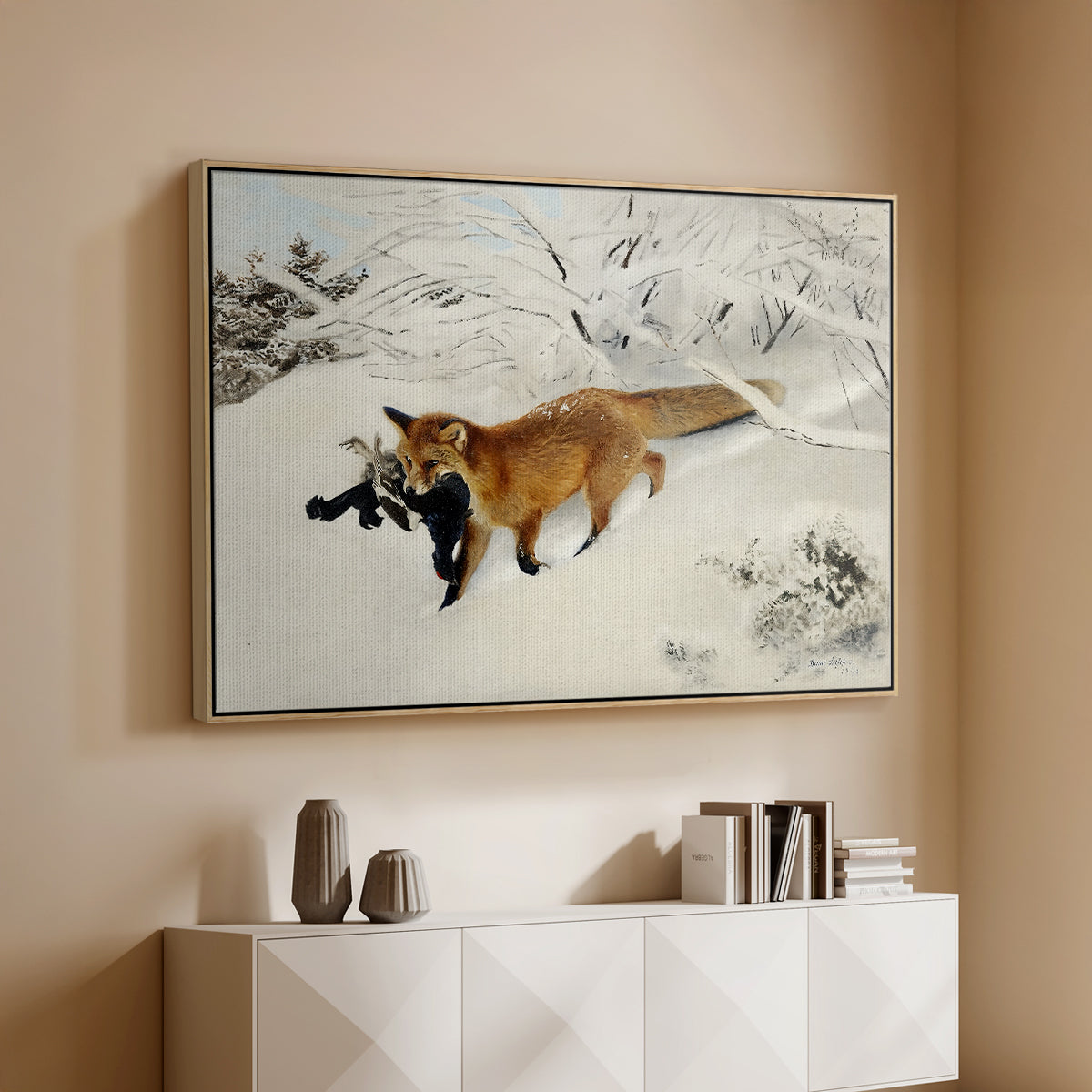 Natural wood floater framed canvas of Fox in Snow Landscape, 1900 by Bruno Liljefors, featuring a wildlife scene of fox moving swiftly through winter terrain above a console cabinet in a minimalist entryway.